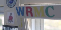 Photo of window with letters WRMC on it at the Middlebury College radio station. Photo: J. Waits
